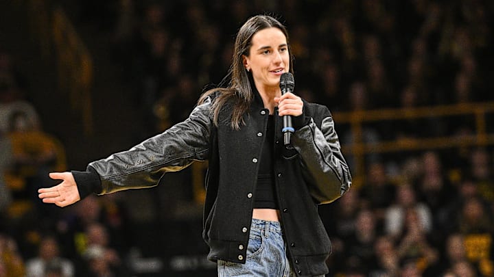 Feb 2, 2025; Iowa City, Iowa, USA; Former Iowa Hawkeyes player Caitlin Clark speaks after the game at Carver-Hawkeye Arena against the USC Trojans. The Hawkeyes retired Clark’s jersey after the game.
