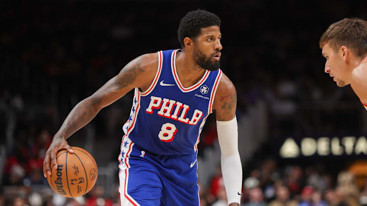 Philadelphia 76ers forward Paul George dribbles against the Atlanta Hawks.
