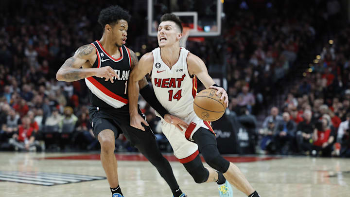 Oct 26, 2022; Portland, Oregon, USA; Miami Heat point guard Tyler Herro (14) dribbles the ball while defended by Portland Trail Blazers shooting guard Anfernee Simons (1) during the second half at Moda Center. Mandatory Credit: Soobum Im-Imagn Images Oct 26, 2022; Portland, Oregon, USA; Miami Heat point guard Tyler Herro (14) dribbles the ball while defended by Portland Trail Blazers shooting guard Anfernee Simons (1) during the second half at Moda Center. Mandatory Credit: Soobum Im-Imagn Images
