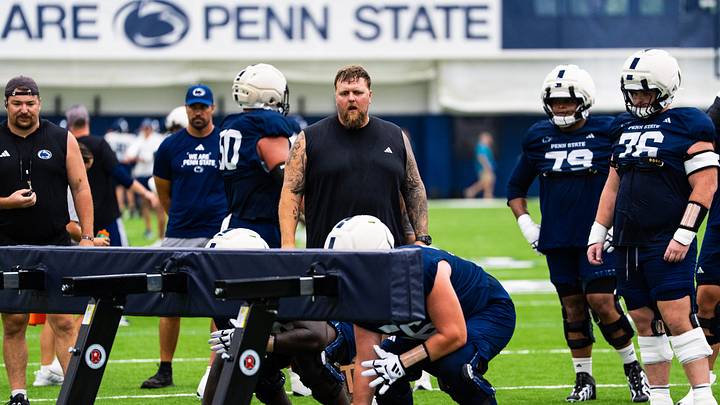 Penn State Nittany Lions offensive line coach Ryan Clanton watches a drill during a practice session inside Holuba Hall. Penn State Nittany Lions offensive line coach Ryan Clanton watches a drill during a practice session inside Holuba Hall.