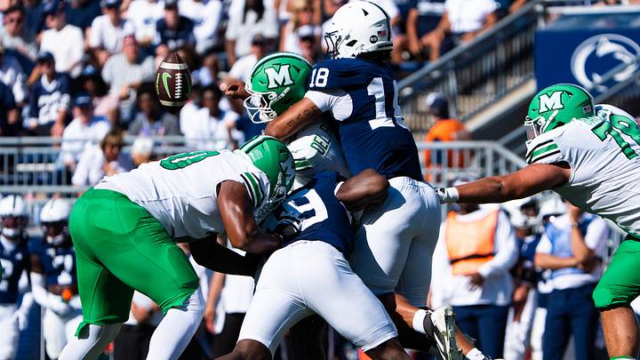 Penn State Nittany Lions defensive end Max Granville (18) tackles Marshall quarterback during a game at Beaver Stadium. Penn State Nittany Lions defensive end Max Granville (18) tackles Marshall quarterback during a game at Beaver Stadium.