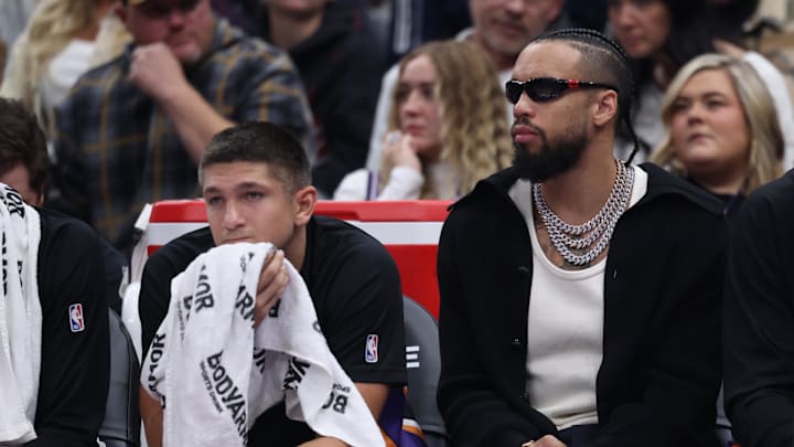 Oct 27, 2025; Salt Lake City, Utah, USA; Phoenix Suns guard Grayson Allen (left) and forward Dillon Brooks (right) watch the game against the Utah Jazz from the bench during the second quarter at Delta Center. Mandatory Credit: Rob Gray-Imagn Images