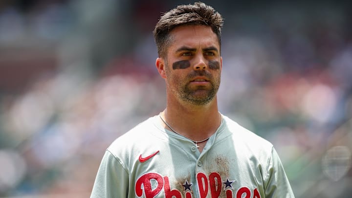 Jul 7, 2024; Atlanta, Georgia, USA; Philadelphia Phillies left fielder Whit Merrifield (9) after an inning against the Atlanta Braves in the second inning at Truist Park. Mandatory Credit: Brett Davis-USA TODAY Sports