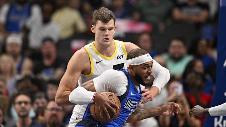 Oct 28, 2024; Dallas, Texas, USA; Utah Jazz center Walker Kessler (24) and Dallas Mavericks center Daniel Gafford (21) in action during the game between the Dallas Mavericks and the Utah Jazz at the American Airlines Center. Mandatory Credit: Jerome Miron-Imagn Images