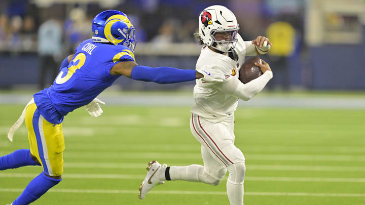 Dec 28, 2024; Inglewood, California, USA;   Arizona Cardinals quarterback Kyler Murray (1) is chased down by Los Angeles Rams safety Kamren Curl (3) in the first half at SoFi Stadium. Mandatory Credit: Jayne Kamin-Oncea-Imagn Images