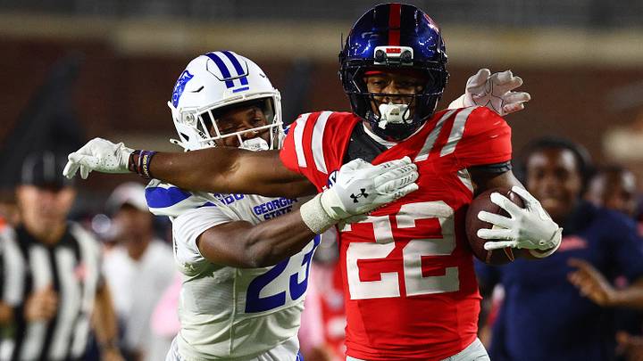 Aug 30, 2025; Oxford, Mississippi, USA; Ole Miss running back Logan Diggs (22) is tackled by Georgia State Panthers defensive back Jaylen Jones (23) during the fourth quarter at Vaught-Hemingway Stadium. Mandatory Credit: Petre Thomas-Imagn Images