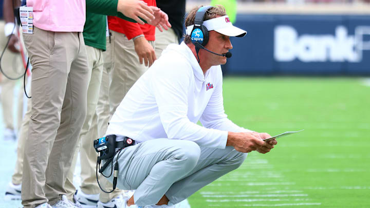 Sep 20, 2025; Oxford, Mississippi, USA; Mississippi Rebels head coach Lane Kiffin looks on during the first quarter against the Tulane Green Wave at Vaught-Hemingway Stadium. Mandatory Credit: Petre Thomas-Imagn Images Sep 20, 2025; Oxford, Mississippi, USA; Mississippi Rebels head coach Lane Kiffin looks on during the first quarter against the Tulane Green Wave at Vaught-Hemingway Stadium. Mandatory Credit: Petre Thomas-Imagn Images