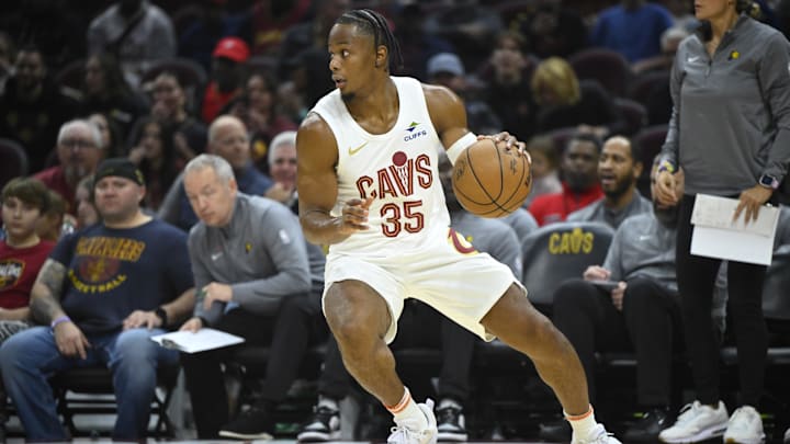 Oct 10, 2024; Cleveland, Ohio, USA; Cleveland Cavaliers forward Isaac Okoro (35) advances the ball in the first quarter against the Indiana Pacers at Rocket Mortgage FieldHouse. Mandatory Credit: David Richard-Imagn Images