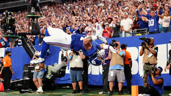 Sep 13, 2026; East Rutherford, New Jersey, USA; New York Giants running back Cam Skattebo (44) does a flip as he celebrates after scoring a touchdown against the Dallas Cowboys during the first quarter at MetLife Stadium. Sep 13, 2026; East Rutherford, New Jersey, USA; New York Giants running back Cam Skattebo (44) does a flip as he celebrates after scoring a touchdown against the Dallas Cowboys during the first quarter at MetLife Stadium.