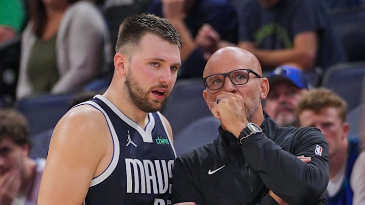 Oct 29, 2024; Minneapolis, Minnesota, USA; Dallas Mavericks guard Luka Doncic (left) and head coach Jason Kidd talk during the game against the Minnesota Timberwolves in the fourth quarter at Target Center. Mandatory Credit: Brad Rempel-Imagn Images