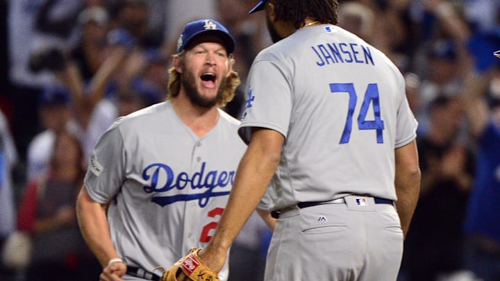 Oct 9, 2017; Phoenix, AZ, USA; Los Angeles Dodgers starting pitcher Clayton Kershaw (22) and relief pitcher Kenley Jansen (74) celebrate the victory against the Arizona Diamondbacks following game three of the 2017 NLDS playoff baseball series at Chase Field. Mandatory Credit: Matt Kartozian-Imagn Images