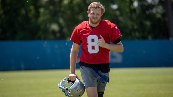 Lions backup quarterback Nate Sudfeld runs off the field after the organized team activities in Allen Park on Thursday, May 23, 2024.