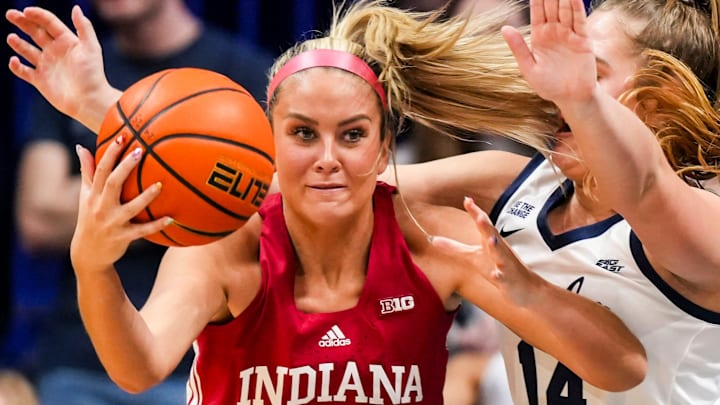 Indiana's Sydney Parrish (33) defended by Butler's Jocelyn Land (14) at Hinkle Fieldhouse. Indiana's Sydney Parrish (33) defended by Butler's Jocelyn Land (14) at Hinkle Fieldhouse.