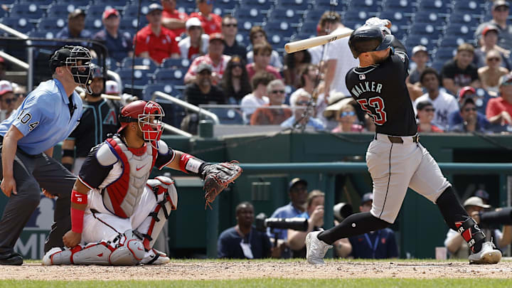 Jun 20, 2024; Washington, District of Columbia, USA; Arizona Diamondbacks first baseman Christian Walker (53) hits a solo home run against the Washington Nationals during the ninth inning at Nationals Park.