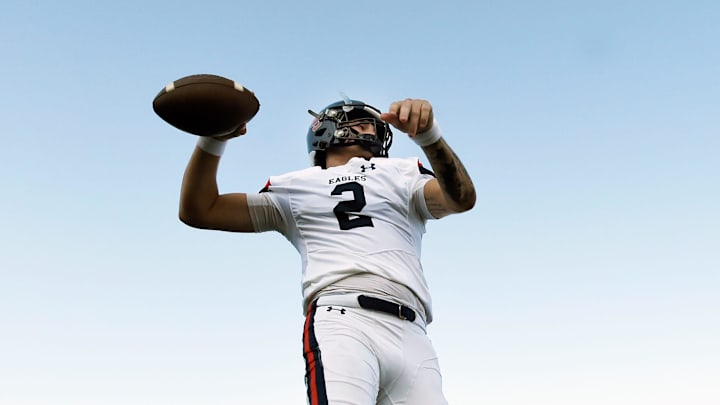 Nashville Christian quarterback Jared Curtis (2) passes as he warms up before an high school football scrimmage against Franklin Road Academy Friday, Aug. 16, 2024, in Nashville, Tenn.