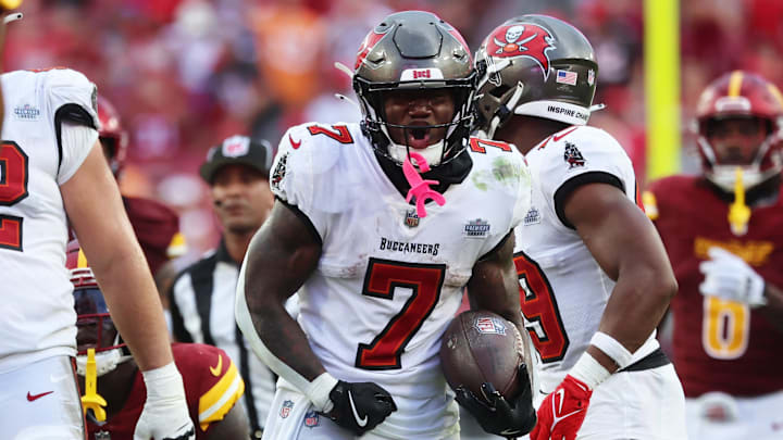 Sep 8, 2024; Tampa, Florida, USA;  Tampa Bay Buccaneers running back Bucky Irving (7) celebrates after he gets a first down against the Washington Commanders during the second half at Raymond James Stadium. Mandatory Credit: Kim Klement Neitzel-Imagn Images