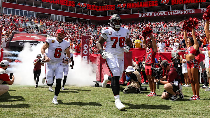 Sep 22, 2024; Tampa, Florida, USA; Tampa Bay Buccaneers quarterback Baker Mayfield (6) and offensive tackle Tristan Wirfs (78) take the field for a game against the Denver Broncos at Raymond James Stadium. Mandatory Credit: Nathan Ray Seebeck-Imagn Images