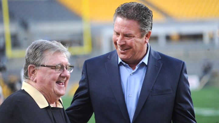 Oct 28, 2019; Pittsburgh, PA, USA; Former Miami Dolphins quarterback Dan Marino (right) talks with Bill Hillgrove, lead play by play broadcaster for the Pittsburgh Steelers before the Steelers play the Dolphins at Heinz Field. Mandatory Credit: Philip G. Pavely-USA TODAY Sports