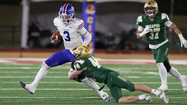 St. Bonaventure's Dylan Dunst tackles Folsom quarterback Ryder Lyons during the fourth quarter of the CIF-State Division 1-A state championship bowl at Saddleback College in Mission Viejo on Saturday, Dec. 9, 2023. St. Bonaventure lost 20-14.