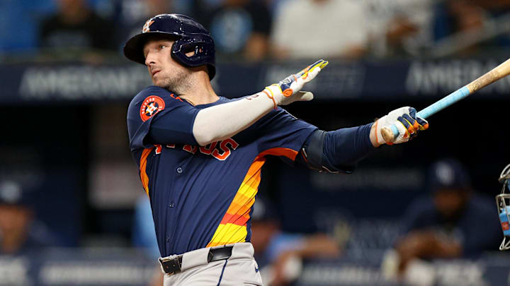 Aug 12, 2024; St. Petersburg, Florida, USA; Houston Astros third baseman Alex Bregman (2) hits a home run against the Tampa Bay Rays in the first inning  at Tropicana Field. Mandatory Credit: Nathan Ray Seebeck-Imagn Images