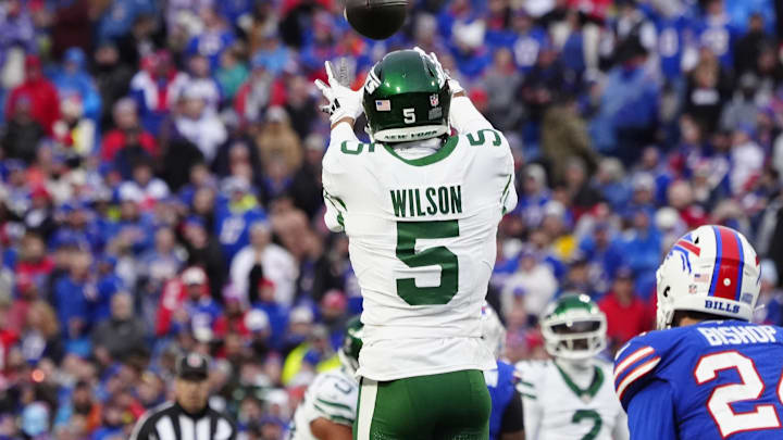 Dec 29, 2024; Orchard Park, New York, USA; New York Jets wide receiver Garrett Wilson (5) makes a catch against the Buffalo Bills during the second half at Highmark Stadium. Mandatory Credit: Gregory Fisher-Imagn Images