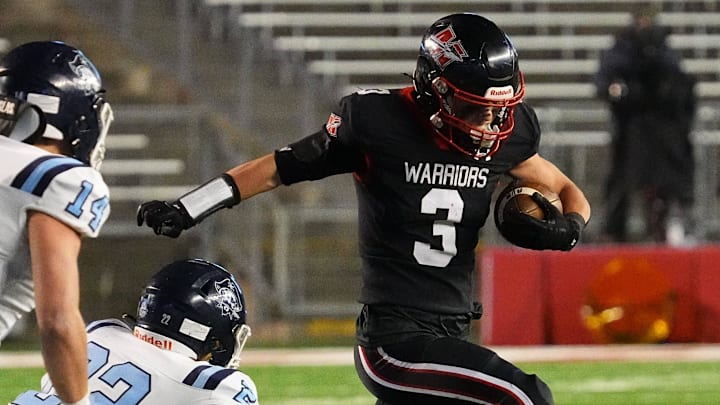 Muskego running back Jackson Niemiec (3) breaks a tackle during the WIAA Division 1 state championship football game at Camp Randall Stadium in Madison on Friday, Nov. 22, 2024.