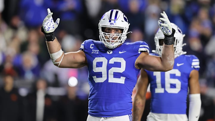 Oct 18, 2024; Provo, Utah, USA; Brigham Young Cougars defensive end Tyler Batty (92) encourages fans to cheer against the Oklahoma State Cowboys during the fourth quarter at LaVell Edwards Stadium. Mandatory Credit: Rob Gray-Imagn Images Oct 18, 2024; Provo, Utah, USA; Brigham Young Cougars defensive end Tyler Batty (92) encourages fans to cheer against the Oklahoma State Cowboys during the fourth quarter at LaVell Edwards Stadium. Mandatory Credit: Rob Gray-Imagn Images