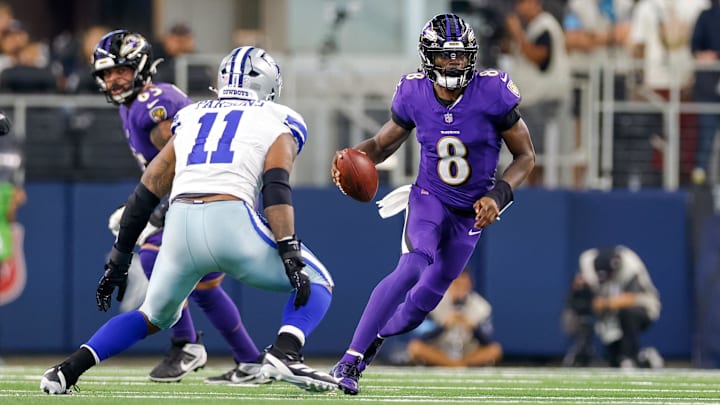 Sep 22, 2024; Arlington, Texas, USA; Dallas Cowboys linebacker Micah Parsons (11) closes on Baltimore Ravens quarterback Lamar Jackson (8) during the third quarter at AT&T Stadium. Mandatory Credit: Andrew Dieb-Imagn Images