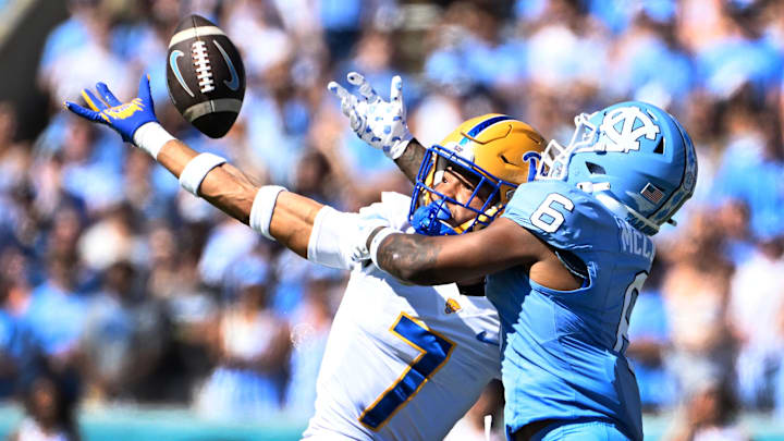 Oct 5, 2024; Chapel Hill, North Carolina, USA; Pittsburgh Panthers defensive back Javon McIntyre (7) breaks up a pass intended for North Carolina Tar Heels wide receiver Nate McCollum (6) in the first quarter at Kenan Memorial Stadium. Mandatory Credit: Bob Donnan-Imagn Images