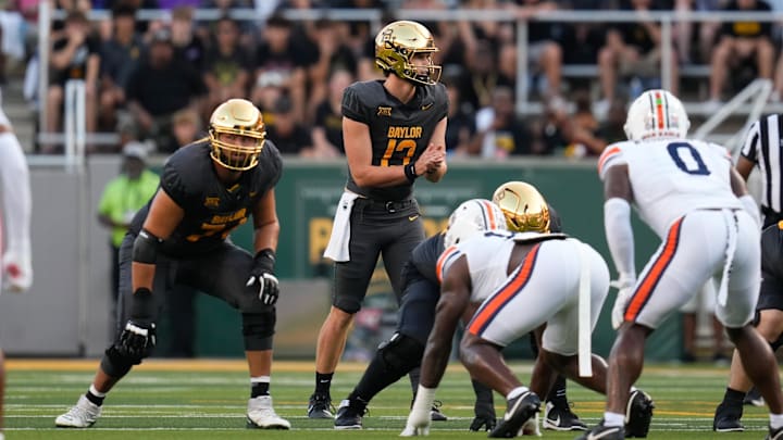 Aug 29, 2025; Waco, Texas, USA;  Baylor Bears quarterback Sawyer Robertson (13) in action against the Auburn Tigers during the first half at McLane Stadium. Mandatory Credit: Chris Jones-Imagn Images