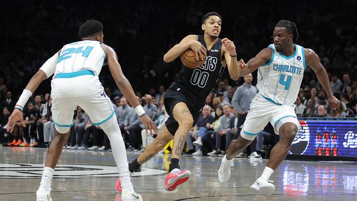 Brooklyn Nets forward Josh Minott (00) drives to the basket against Charlotte Hornets forward Brandon Miller Brooklyn Nets forward Josh Minott (00) drives to the basket against Charlotte Hornets forward Brandon Miller
