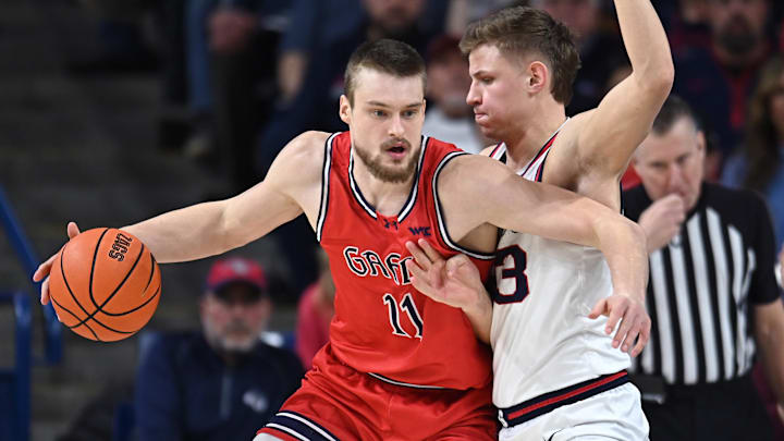 Feb 22, 2025; Spokane, Washington, USA; St. Mary's Gaels center Mitchell Saxen (11) fights for position against Gonzaga Bulldogs forward Ben Gregg (33) in the first half at McCarthey Athletic Center. Mandatory Credit: James Snook-Imagn Images