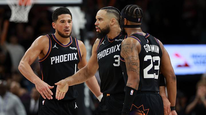 Jan 4, 2026; Phoenix, Arizona, USA; Phoenix Suns forward Dillon Brooks (3) celebrates with teammates Devin Booker (1) and Jordan Goodwin (23) against the Oklahoma City Thunder in the second half at Mortgage Matchup Center. Mandatory Credit: Mark J. Rebilas-Imagn Images