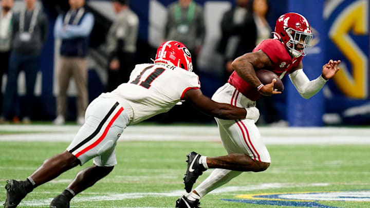 Dec 2, 2023; Atlanta, GA, USA; Georgia Bulldogs linebacker Jalon Walker (11) sacks Alabama Crimson Tide quarterback Jalen Milroe (4) in the first quarter of the SEC Championship at Mercedes-Benz Stadium. Mandatory Credit: John David Mercer-Imagn Images