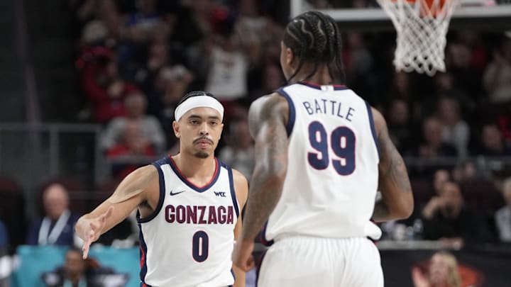 Gonzaga seniors Ryan Nembhard (0) and Khalif Battle (99).