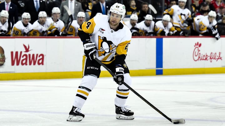 Apr 11, 2025; Newark, New Jersey, USA; Pittsburgh Penguins defenseman Matt Grzelcyk (24) controls the puck during the third period against the New Jersey Devils at Prudential Center. Mandatory Credit: John Jones-Imagn Images