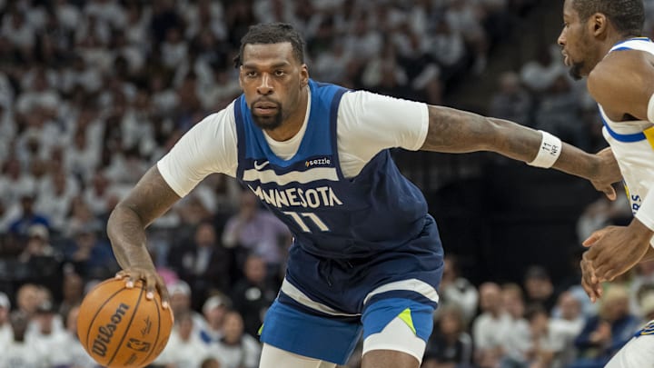 May 14, 2025; Minneapolis, Minnesota, USA; Minnesota Timberwolves center Naz Reid (11) dribbles the ball against the Golden State Warriors in the first half during game five of the second round for the 2025 NBA Playoffs at Target Center. Mandatory Credit: Jesse Johnson-Imagn Images