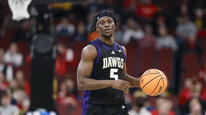 Mar 12, 2026; Chicago, IL, USA; Washington Huskies guard Zoom Diallo (5) brings the ball up court against the Wisconsin Badgers during the first half at United Center. Mandatory Credit: Kamil Krzaczynski-Imagn Images