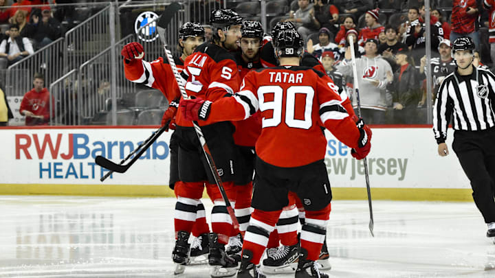 Oct 19, 2024; Newark, New Jersey, USA; New Jersey Devils center Nico Hischier (13) celebrates with teammates after scoring a goal against the Washington Capitals during the second period at Prudential Center. Mandatory Credit: John Jones-Imagn Images