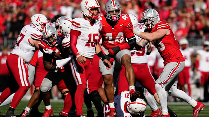 Ohio State Buckeyes defensive end JT Tuimoloau (44) celebrates a tackle of Nebraska Cornhuskers running back Emmett Johnson (21) during the second half of the NCAA football game at Ohio Stadium in Columbus on Saturday, Oct. 26, 2024. Ohio State won 21-17.