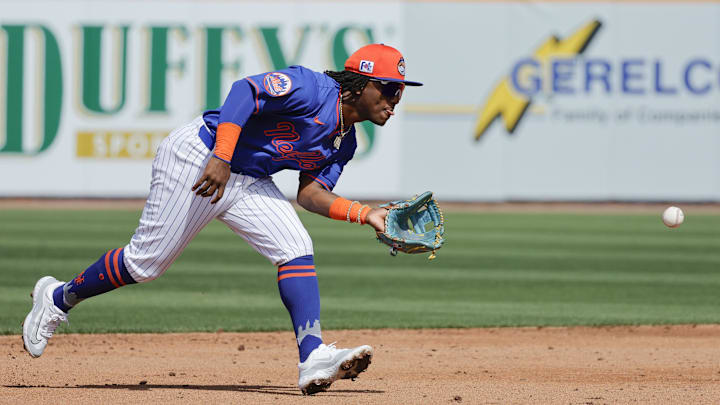 Feb 23, 2025; Port St. Lucie, Florida, USA;  New York Mets shortstop Luisangel Acuna (2) fields a ground ball during the third inning against the Miami Marlins at Clover Park. Mandatory Credit: Reinhold Matay-Imagn Images