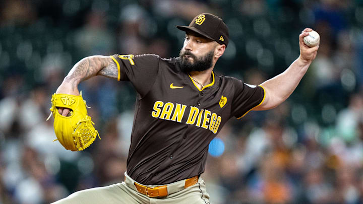 Sep 10, 2024; Seattle, Washington, USA;  San Diego Padres reliever Tanner Scott (66) delivers a pitch against the Seattle Mariners at T-Mobile Park. Mandatory Credit: Stephen Brashear-Imagn Images
