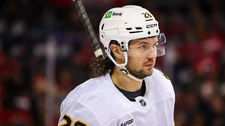 Dec 29, 2025; Calgary, Alberta, CAN; Boston Bruins defenseman Andrew Peeke (26) during the second period against the Calgary Flames at Scotiabank Saddledome. Mandatory Credit: Sergei Belski-Imagn Images