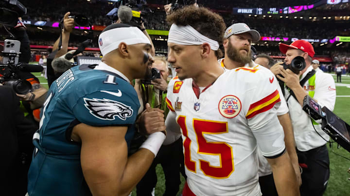 Feb 9, 2025; New Orleans, LA, USA; Philadelphia Eagles quarterback Jalen Hurts (1) greets Kansas City Chiefs quarterback Patrick Mahomes (15) following Super Bowl LIX at Ceasars Superdome. Mandatory Credit: Mark J. Rebilas-Imagn Images