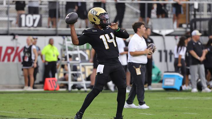 Sep 3, 2026; Orlando, Florida, USA;  Central Florida quarterback Alonza Barnett III (14) warms up before a game against Bethune-Cookman at Acrisure Bounce House.  Mandatory Credit: Mike Watters-Imagn Images