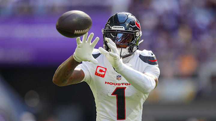 Houston Texans wide receiver Stefon Diggs (1) warms up before the game against the Minnesota Vikings at U.S. Bank Stadium. 