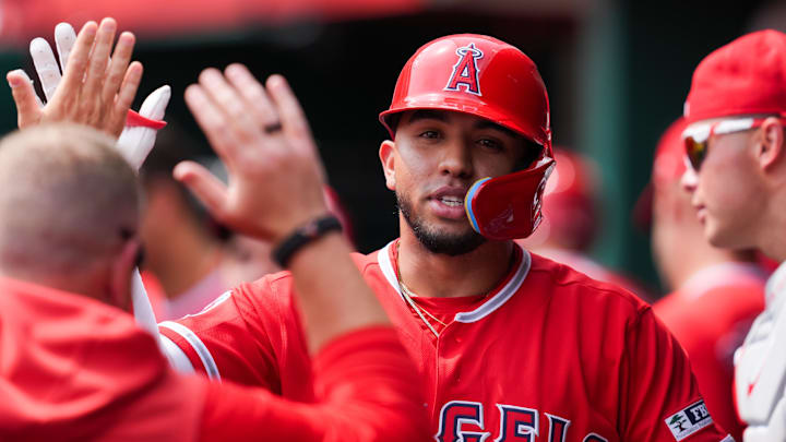 Apr 12, 2026; Cincinnati, Ohio, USA; Los Angeles Angels third baseman Oswald Peraza (2) high-fives teammates after hitting a solo home run against the Cincinnati Reds in the fourth inning at Great American Ball Park. Mandatory Credit: Aaron Doster-Imagn Images Apr 12, 2026; Cincinnati, Ohio, USA; Los Angeles Angels third baseman Oswald Peraza (2) high-fives teammates after hitting a solo home run against the Cincinnati Reds in the fourth inning at Great American Ball Park. Mandatory Credit: Aaron Doster-Imagn Images