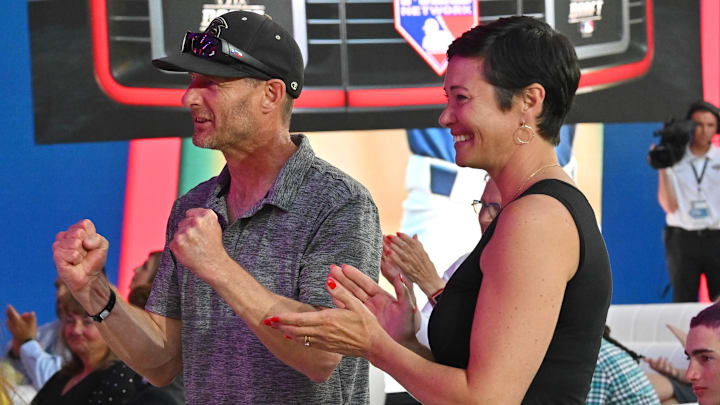 Jul 17, 2022; Los Angeles, CA, USA;  Ian Ritchie and Torie RItchie celebrate after their son JR Ritchie was selected by the Atlanta Braves as the 35th pick of the MLB draft at XBox Plaza at LA Live. Mandatory Credit: Jayne Kamin-Oncea-Imagn Images