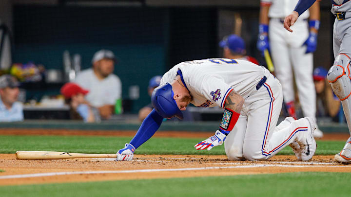 Jun 4, 2024; Arlington, Texas, USA; Texas Rangers catcher Jonah Heim (28) injures himself on a swing during the third inning against the Detroit Tigers at Globe Life Field. 