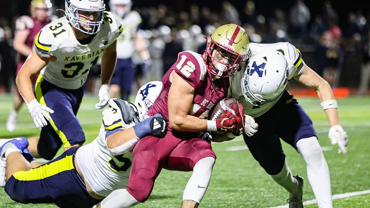 BC High's Jackson Richard is tackled by three Xaverian defenders during a game at BC High on Friday, Oct. 18, 2024. BC High's Jackson Richard is tackled by three Xaverian defenders during a game at BC High on Friday, Oct. 18, 2024.